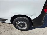 a white van that is parked on the side of the road