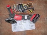 a box of assorted tools on a wooden table
