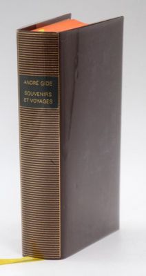 a book that is sitting on a table with a yellow ribbon