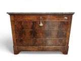 an antique chest of drawers with marble top