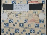 an old envelope with a note attached to it with a sticker attached to it