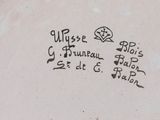 a close up of a plate with writing on it