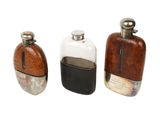 three small bottles that are sitting next to each other