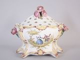 a white bowl with a pink rose decoration on it