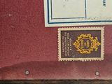 a picture of a red suitcase with stamps on it
