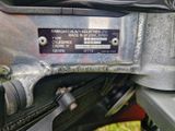 a close up of a motorcycle with a metal plate on the back of it