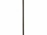 the floor lamp is made of metal and has a glass shade