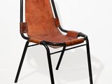 a brown leather chair with black legs and a black frame