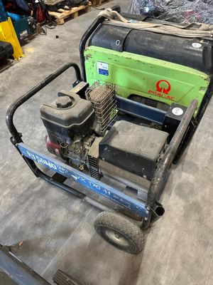a lawn mower that is sitting in the garage