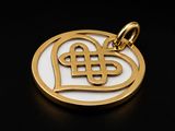 a gold plated pendant with a celtic knot in the shape of a heart