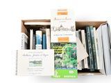 a box full of books on a white surface