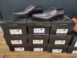 several boxes of shoes are stacked on top of each other