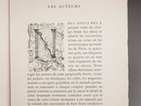 an open book with a drawing of a bird on it