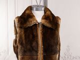 an image of a fur vest on a mannequin stand