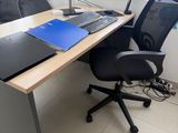 a desk with a laptop and a monitor on it