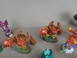 many figurines of different types and colors on the table