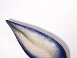 a blue and white glass object on a white surface