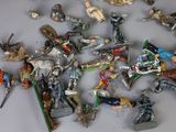 a lot of figurines that are sitting on a table