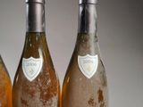 three bottles of wine sitting next to each other on a table