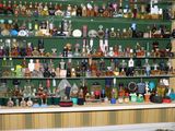 many bottles of liquor on the shelves in the room
