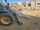 a tractor that is parked on the side of the road
