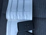 two remote controls sitting on top of a piece of paper