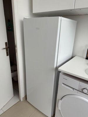 an image of a kitchen with a washer and dryer