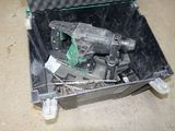 a tool in a case that is sitting on the floor