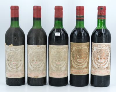 four bottles of wine are lined up in a row