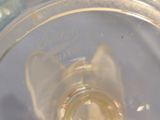 a close up of a glass with a liquid inside of it