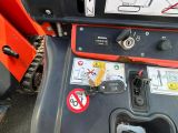 a close up of a tractor with a sign on the back of it