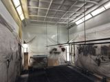 a picture of a large room with a lot of stuff on the floor