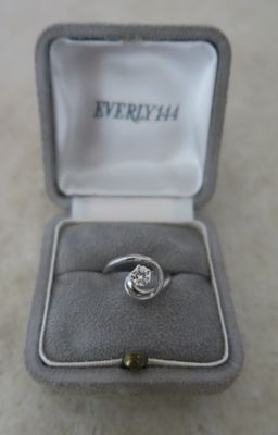 a ring that is sitting in a box on the floor