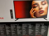 the box is open to show the contents of the new tv