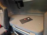 a seat in the back of a car with a laptop on it