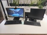 deux écrans d'ordinateur et un clavier sur un bureau
