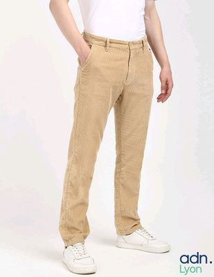 a man standing with his hands in his pockets
