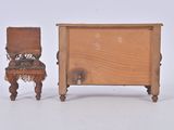 a small wooden chair next to a small wooden table
