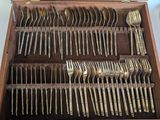 many forks and spoons in a case on the table