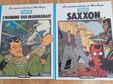 two comics are sitting on a table next to each other