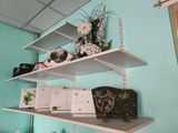 a shelf that has a bunch of books on it