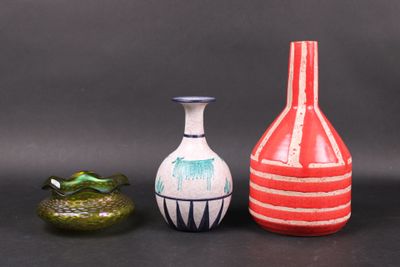 three vases sitting next to each other on a table