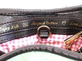 a close up of a purse that has a ring on it