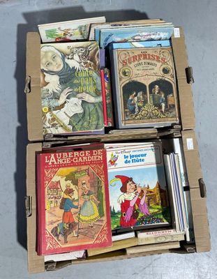 boxes of children ' s books are stacked on top of each other