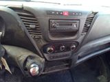 a dashboard of a car with a radio and other items in it