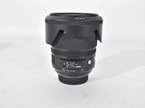 a camera lens that is sitting on a white surface