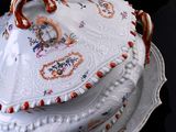 a white plate with a cake on it on a black table