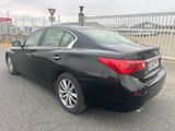 a picture of a black car parked in a parking lot