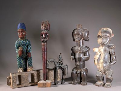 several wooden figurines sitting on top of a table next to each other