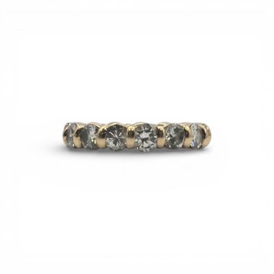 a close up of a diamond ring on a white background